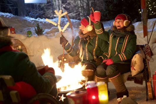 Explore the magical wonders of Santa's Village in the North Pole with Mrs. Claus' photo of elves roasting marshmallows, yummy!